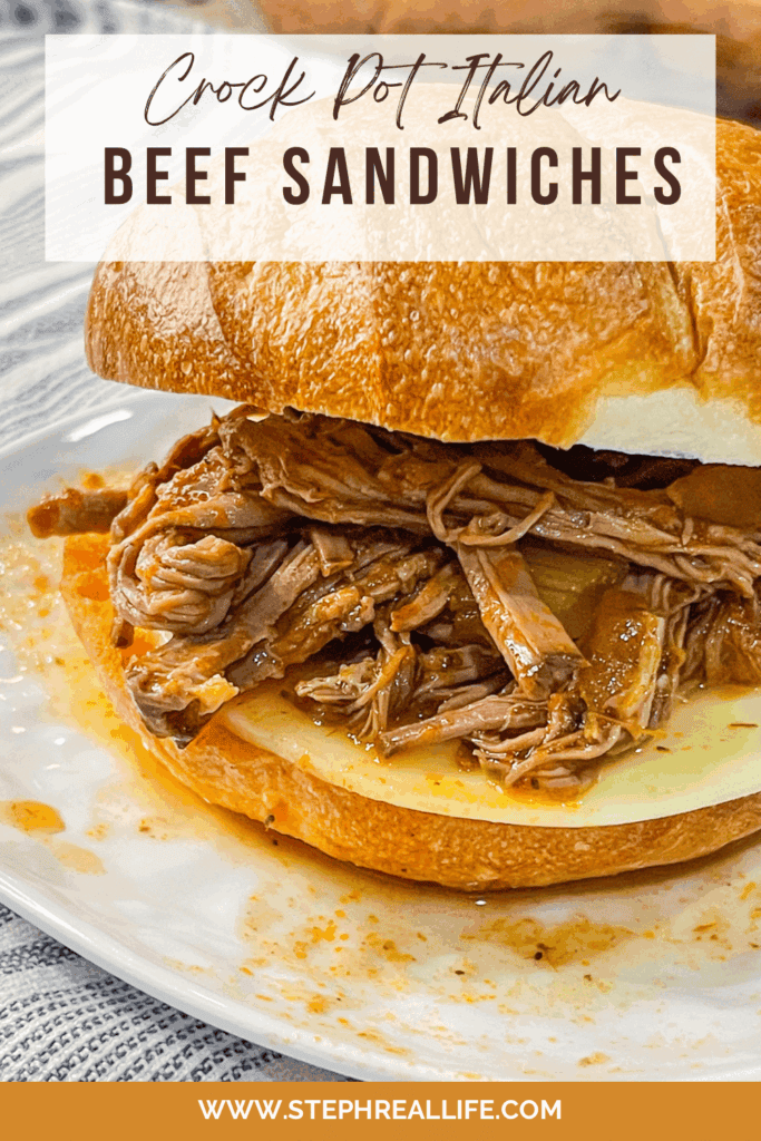 A close-up of Crock Pot Italian Beef Sandwiches, featuring shredded Italian beef and melted cheese on a toasted bun, sits on a white plate. The text on the image reads: Crock Pot-Italian Beef Sandwiches.