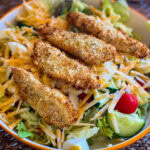 Crispy, golden, and perfectly seasoned—these freezer-friendly Air Fryer Crispy Chicken Strips are about to become your new go-to for busy weeknights, easy lunches, or last-minute dinners. Below you'll find instructions for prepping and air frying perfectly crisp chicken strips as well as freezing directions, so you always have them on hand!