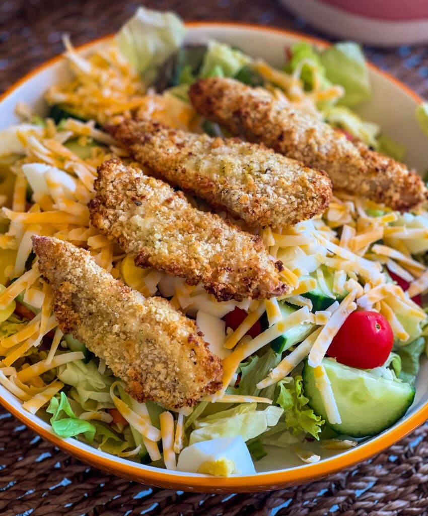 Crispy, golden, and perfectly seasoned—these freezer-friendly Air Fryer Crispy Chicken Strips are about to become your new go-to for busy weeknights, easy lunches, or last-minute dinners. Below you'll find instructions for prepping and air frying perfectly crisp chicken strips as well as freezing directions, so you always have them on hand!