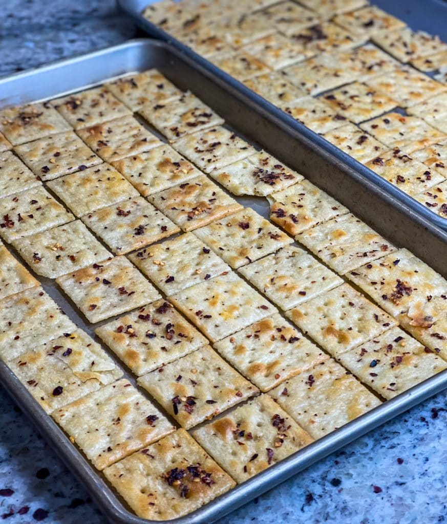 Alabama Firecrackers are a spicy and savory snack made with red pepper flakes, ranch seasoning, and oil baked on saltine crackers. These make the perfect party snack and are a cinch to whip together.