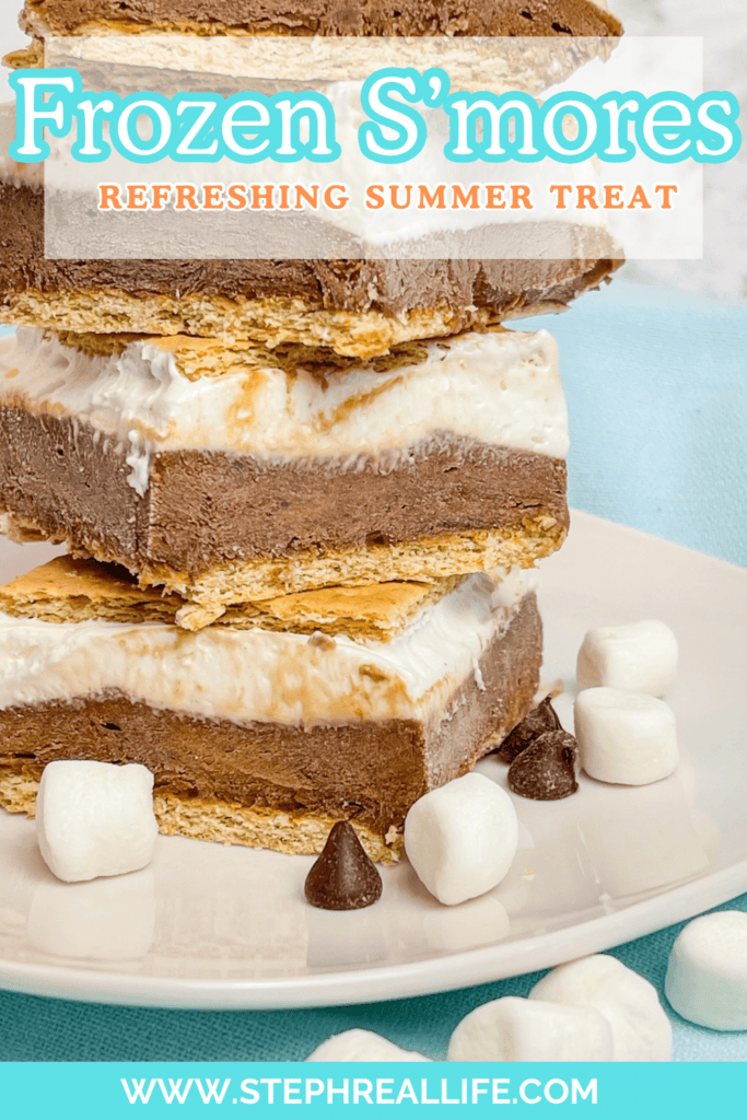A stack of Frozen S’mores bars with layers of graham crackers, chocolate, and marshmallow sits on a white plate, surrounded by mini marshmallows and chocolate chips. Text reads Frozen S’mores—your refreshing summer treat!.