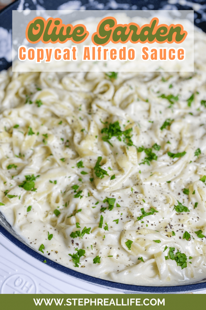 A skillet filled with creamy fettuccine tossed in Copycat Olive Garden Alfredo Sauce, topped with chopped parsley and black pepper. Text overlay reads, “Olive Garden Copycat Alfredo Sauce” with a website link at the bottom.