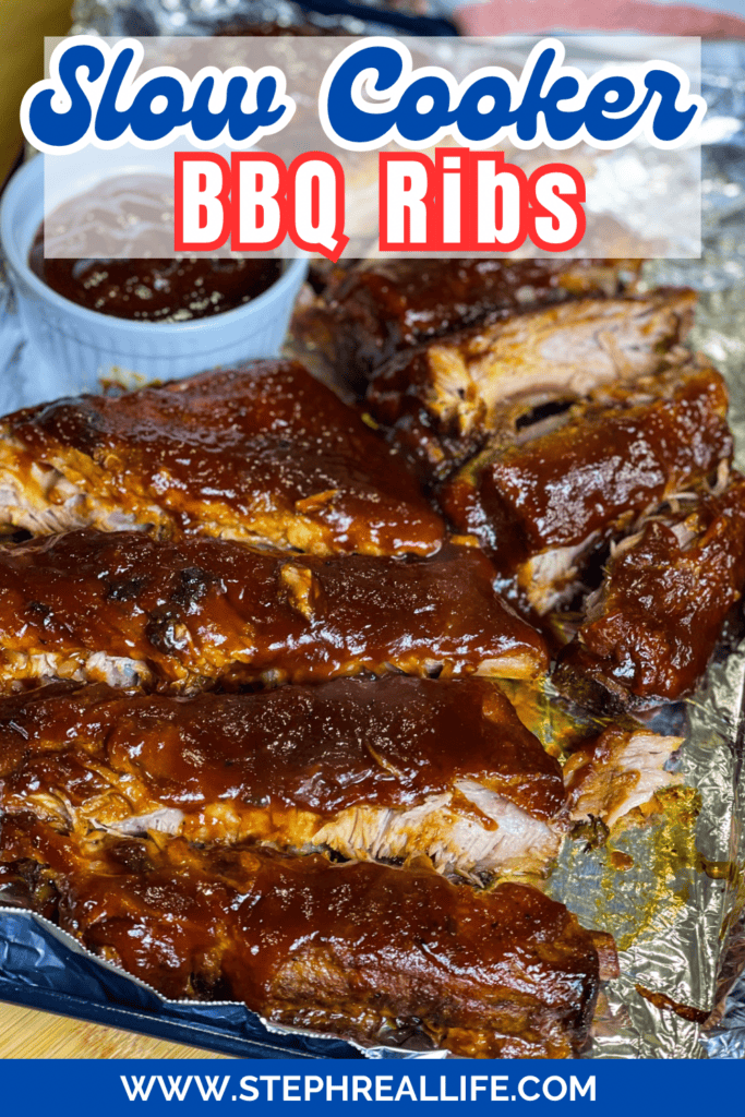 Close-up of saucy Crock Pot BBQ Ribs on foil, with a cup of barbecue sauce in the background. Text reads Slow Cooker BBQ Ribs at the top, and a website URL is displayed at the bottom.