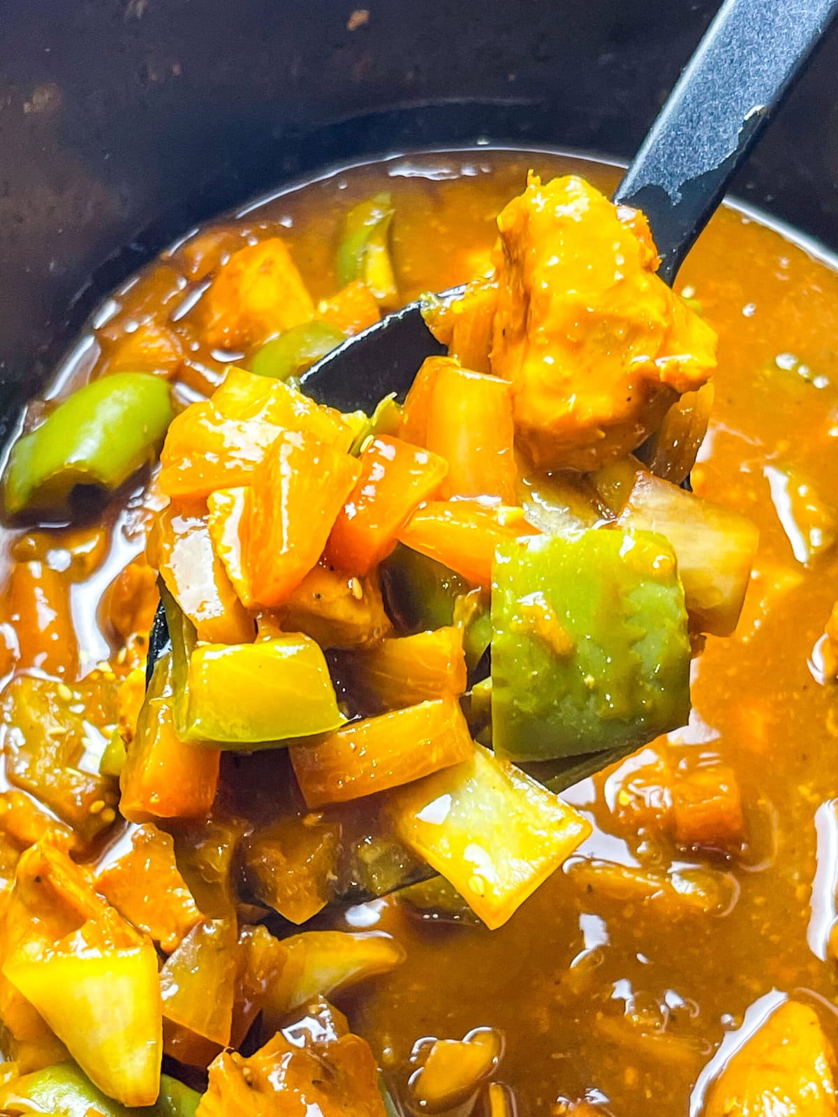 Slow Cooker BBQ Pineapple Chicken is an easy crock pot dinner made with chicken breast, your favorite BBQ sauce, canned pineapple, onions and bell peppers. This saucy meal can be served over rice, potatoes or pasta.