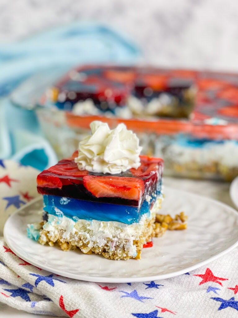 Looking for a no-fuss, festive treat for the 4th of July? This Patriotic Pretzel Salad is a salty-sweet layered dessert that combines crunchy pretzels, creamy whipped topping, and vibrant red and blue Jell-O bursting with fruit. It’s a fun twist on the nostalgic classic and always a crowd favorite!