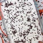This Chocolate Lasagna dessert with a brownie crust is the ultimate chocolate lover's treat! It has a layer of rich fudgy brownie, a tangy cream cheese layer, a cool and creamy chocolate pudding layer and is topped off with whipped cream and mini chocolate chips. Perfect for a party, potluck, or get-together!
