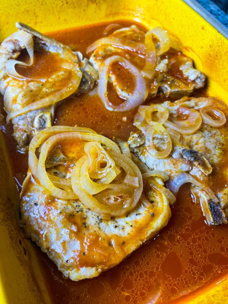 These Pittsburgh Pork Chops are a classic—juicy, oven-baked pork chops smothered in sweet and tangy chili sauce, soft caramelized onions, and a savory pan gravy that’s begging to be poured over mashed potatoes.