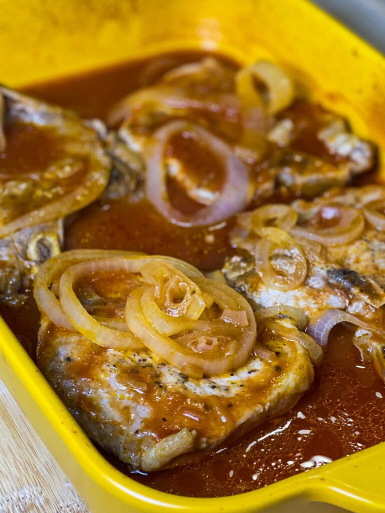 These Pittsburgh Pork Chops are a classic—juicy, oven-baked pork chops smothered in sweet and tangy chili sauce, soft caramelized onions, and a savory pan gravy that’s begging to be poured over mashed potatoes.