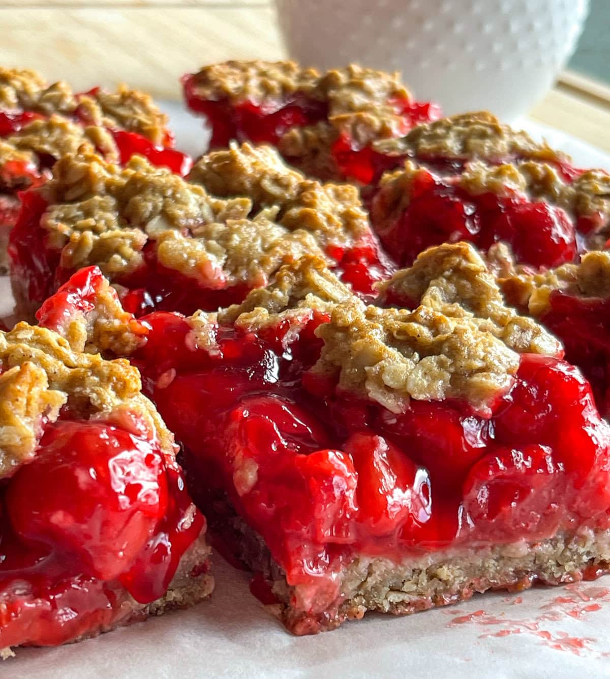 Cherry Apple Oat Bars have a chewy oat crust, sweet-tart cherry apple fruit filling, and a crumbly crunchy oat topping.