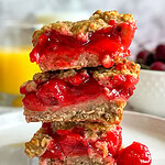 Cherry Apple Oat Bars have a chewy oat crust, sweet-tart cherry apple fruit filling, and a crumbly crunchy oat topping.