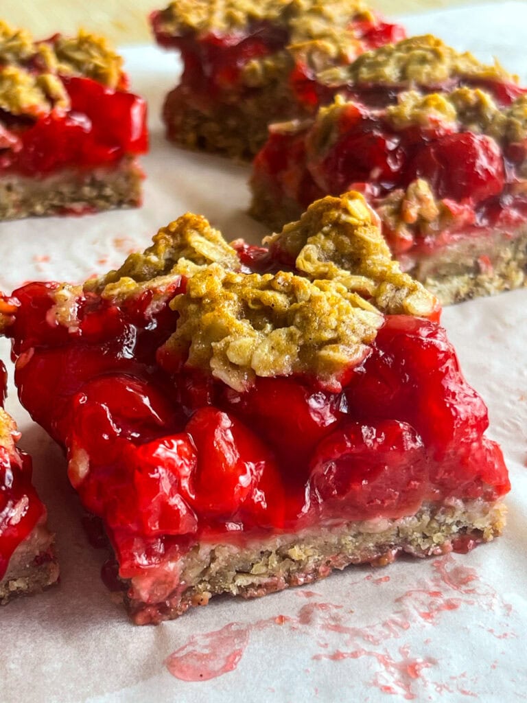 Cherry Apple Oat Bars have a chewy oat crust, sweet-tart cherry apple fruit filling, and a crumbly crunchy oat topping.