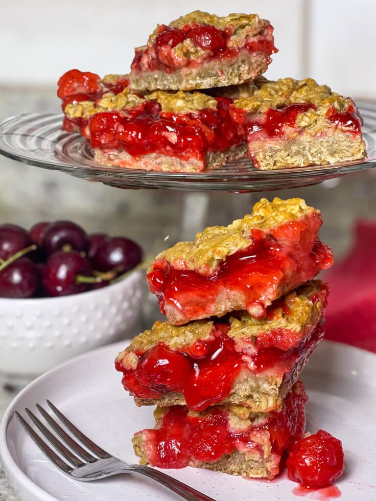 Cherry Apple Oat Bars have a chewy oat crust, sweet-tart cherry apple fruit filling, and a crumbly crunchy oat topping.