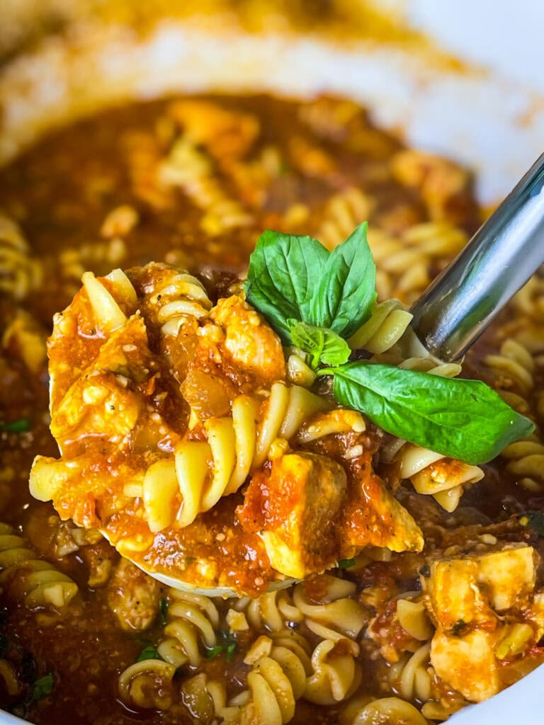 This Slow Cooker Chicken Parmesan Soup is cheesy, hearty, and topped with crispy breadcrumbs for that classic Chicken Parm crunch!