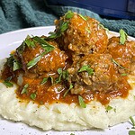 ground meat stuffed with rice slow cooked in a tomato based sauce