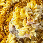 Close-up of a creamy Chicken Cordon Bleu Casserole with chicken, ham, and noodles under a toasted Panko topping.