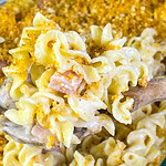 Close-up of a creamy Chicken Cordon Bleu Casserole with chicken, ham, and noodles under a toasted Panko topping.