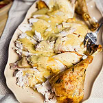 carved turkey slices with gravy over top