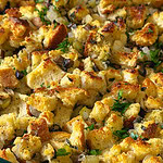 homemade stuffing with celery and mushrooms in a glass baking dish