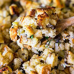 homemade stuffing with celery and mushrooms in a glass baking dish