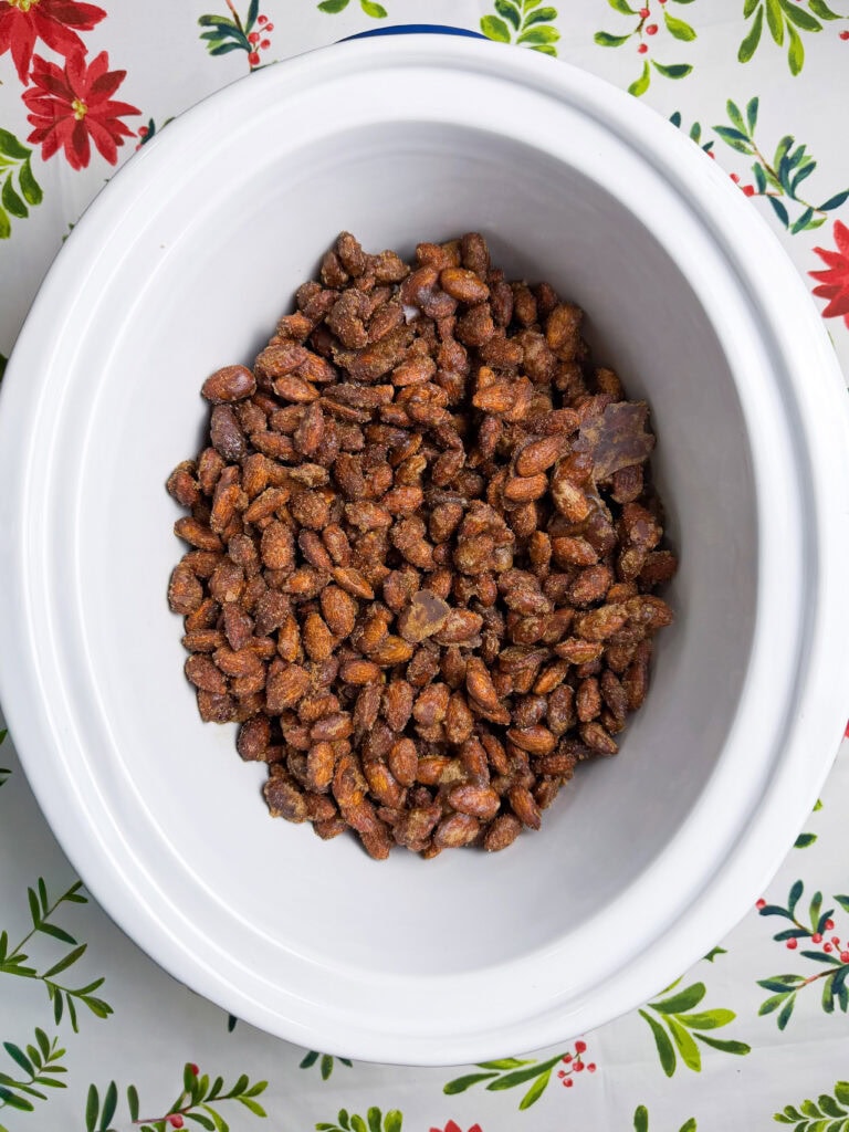 almonds coated in cinnamon and sugar in a crock pot