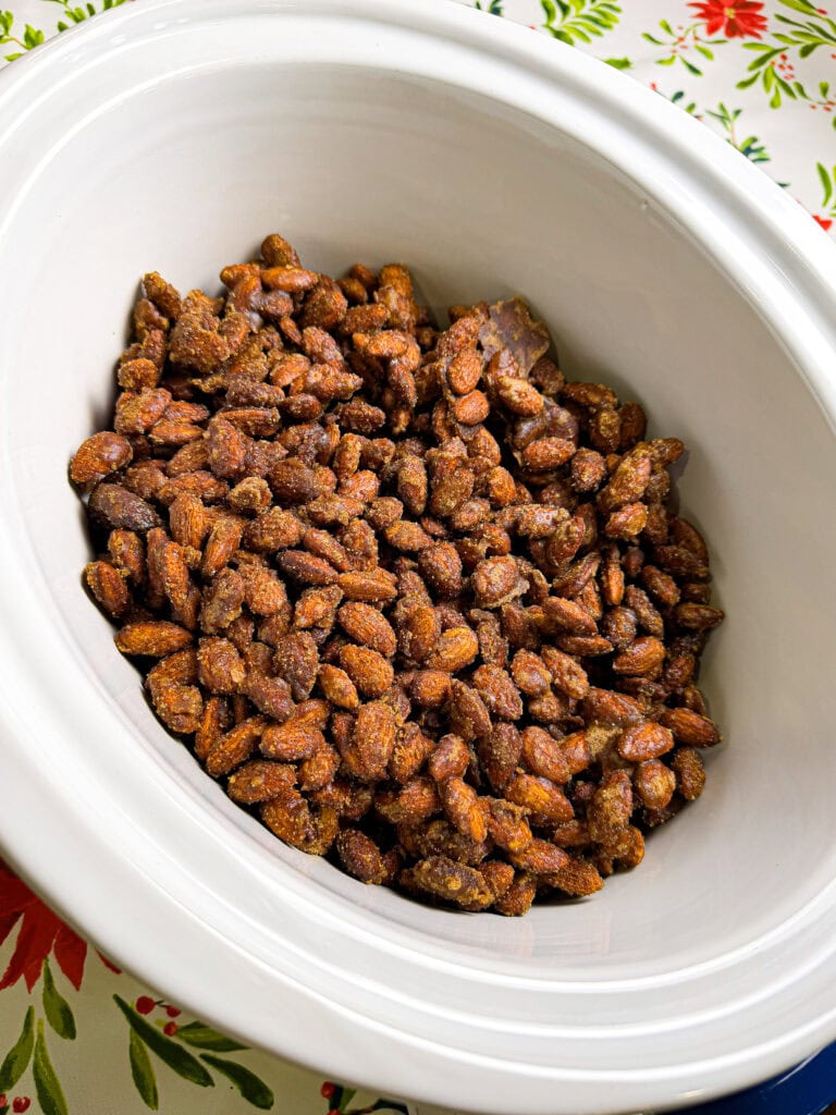 almonds coated in cinnamon and sugar in a crock pot