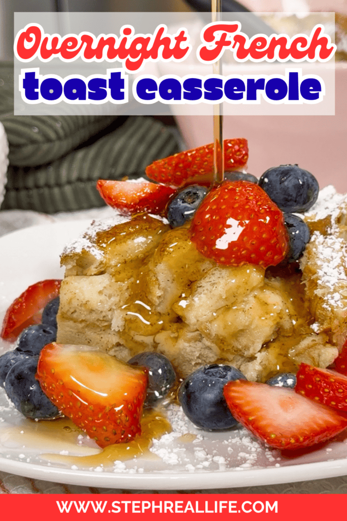 A plate of overnight French toast casserole topped with fresh strawberries, blueberries, powdered sugar, and syrup being poured, with a website URL at the bottom: www.stephreallife.com.