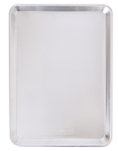 A plain, empty rectangular metal baking sheet with slightly raised edges, photographed from above against a white background.